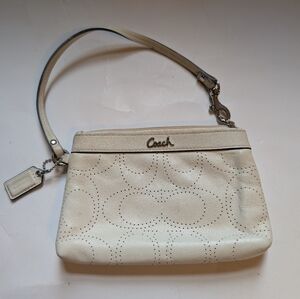 Coach perforated logo leather wristlet in a off-white color in VGUC